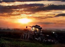 Tractor in a field of holes holes holes .. / ***