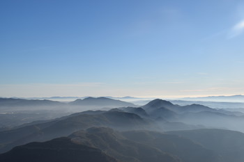 Mountains with fog / view of mountains with fog from Montserrat in Spain