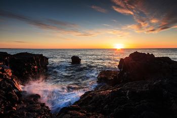 Sunset over the ocean / ***