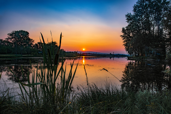 Sunset over the lake / ***