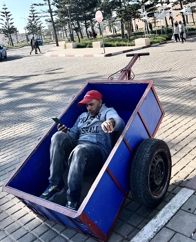 Checking mail / In a great shady spot in the port city Essaouira