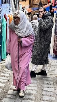 Buying a new dress / A lady in the market in Morocco