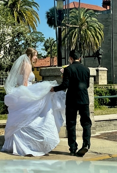 Before walking down the aisle / Bride and Bridegroom’s trying to avoid a puddle