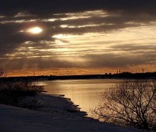 Sunset over a river. / ***