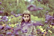 A girl in a flower garden. / girl in a flower garden