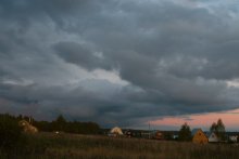 Above the village frowning clouds go ... / ***