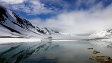 Norway, in July, water, mountains, sun and fog. / ****