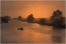 Golden morning. / A fisherman in the morning light.