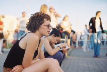 girl sitting on the curb / ...