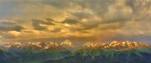 Stormy sunrise over the mountains. / ***