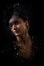 Portrait of a lady in a dark ... / ***