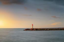 Lighthouse at sunset / ***