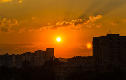 Sunset over the city / ***