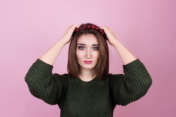 Girl on a pink background. / ***