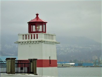 Lookout / entering lighthouse cautions ships of narrow passage to Vancouver Harbors.