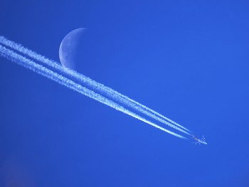 wInter sky above my home / I had a great chance to shoot both jet and moon at the same time. This doesn’t happen often. Only in the winter time certain moment, I was lucky enough.