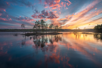 The Aftermath / A still lake offers fantastic reflections, and this spring produced some very nice sunsets - Ringerike, Norway.