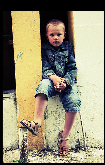 portrait of a boy in sandals