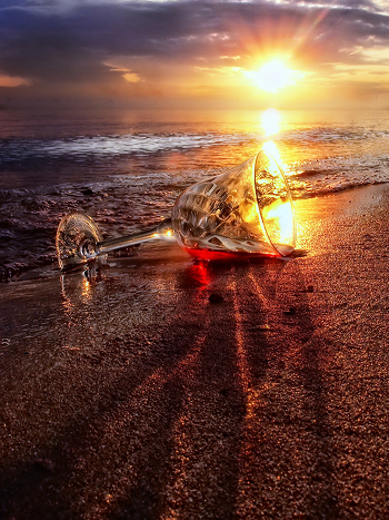 Red wine, water and sunset