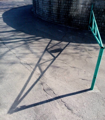 "Navel shadow on the fence"