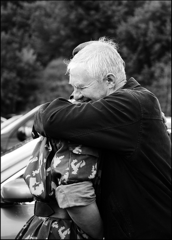 Father hugs his son