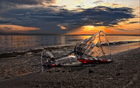 Red wine, water and sunset