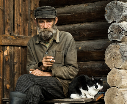 Village portrait with a cat Stepan