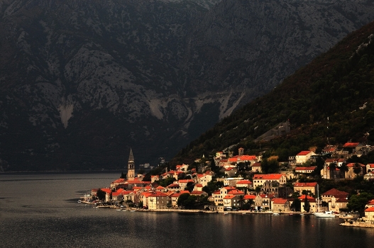 at the foot of the mountains