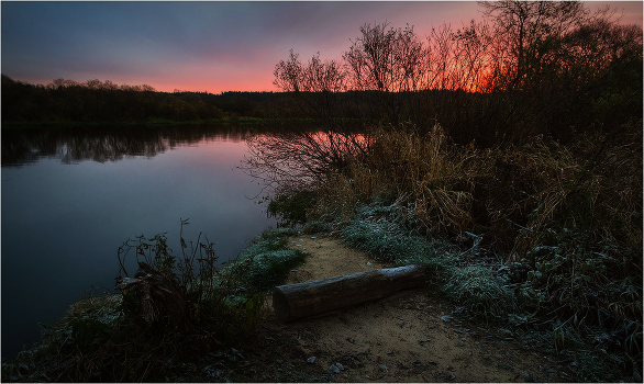 Fisherman with a bench at dawn