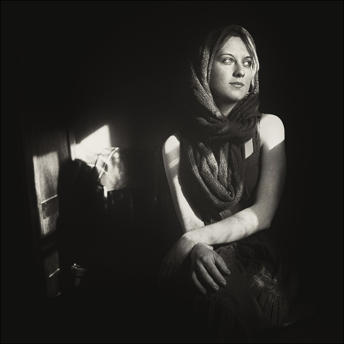 Portrait of Anna with an old chair and the April sun