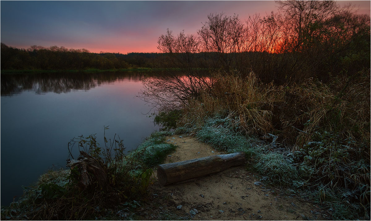Fisherman with a bench at dawn