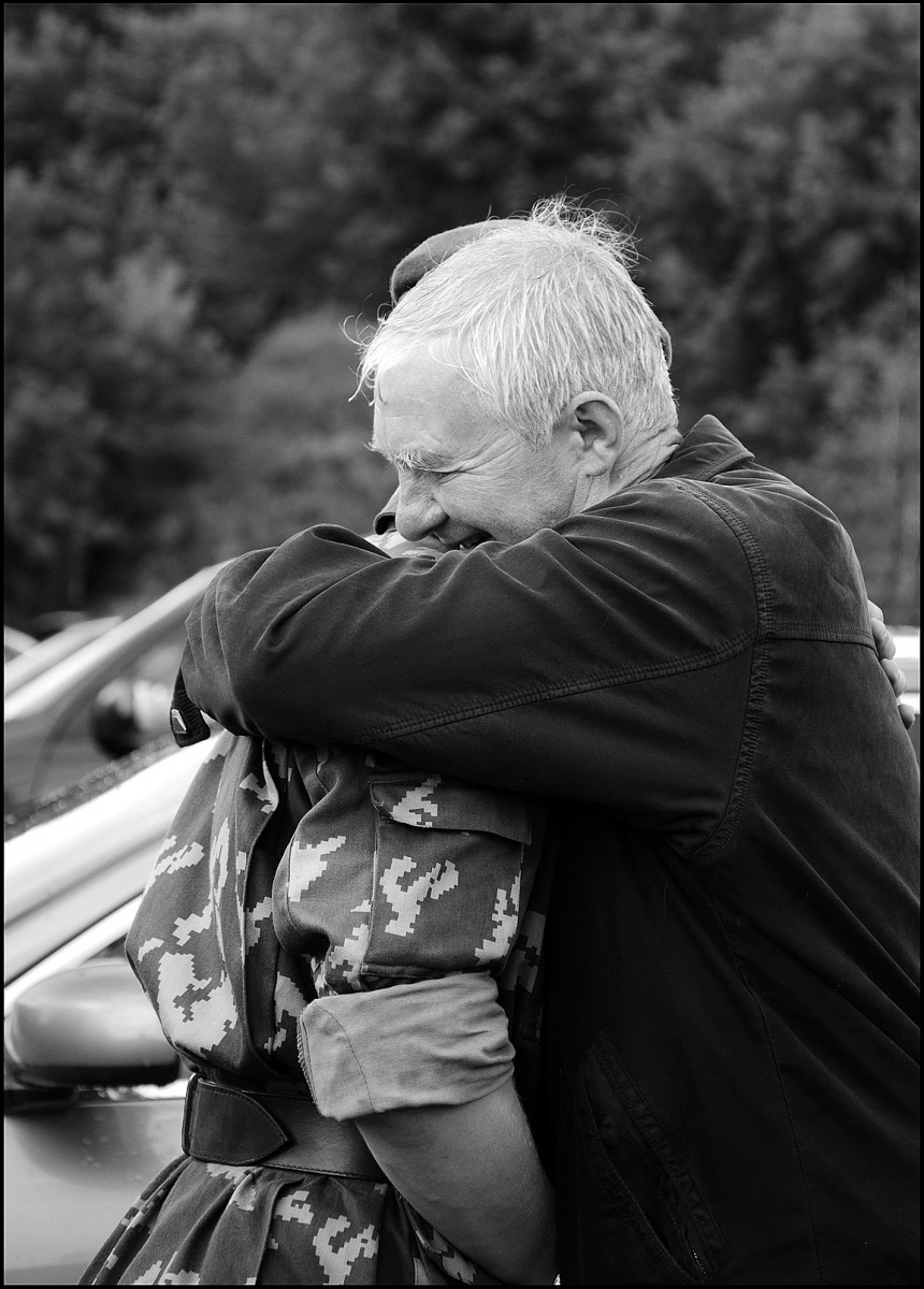 Father hugs his son